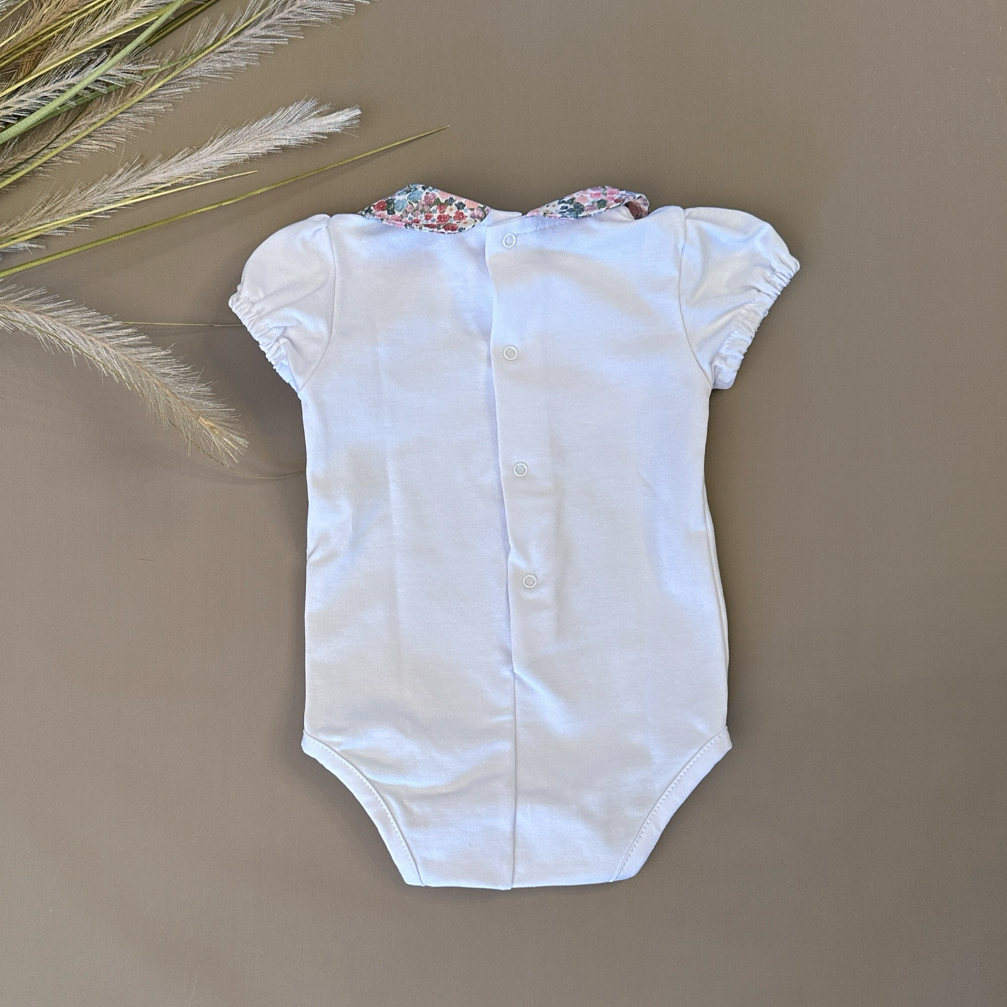 Body in jersey di cotone con il colletto floreale
