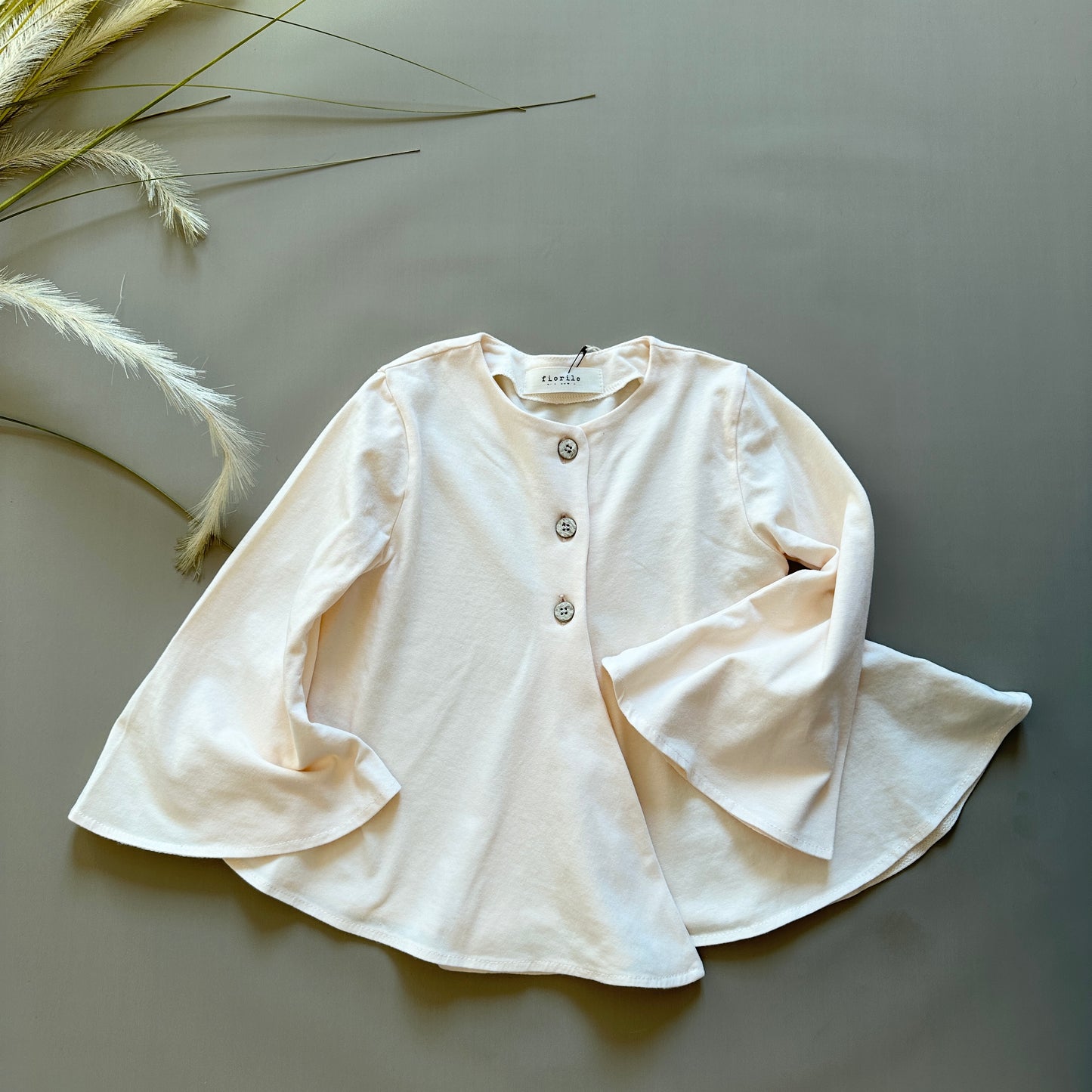 Cardigan svasato con maniche a campana color pesca in jersey di cotone
