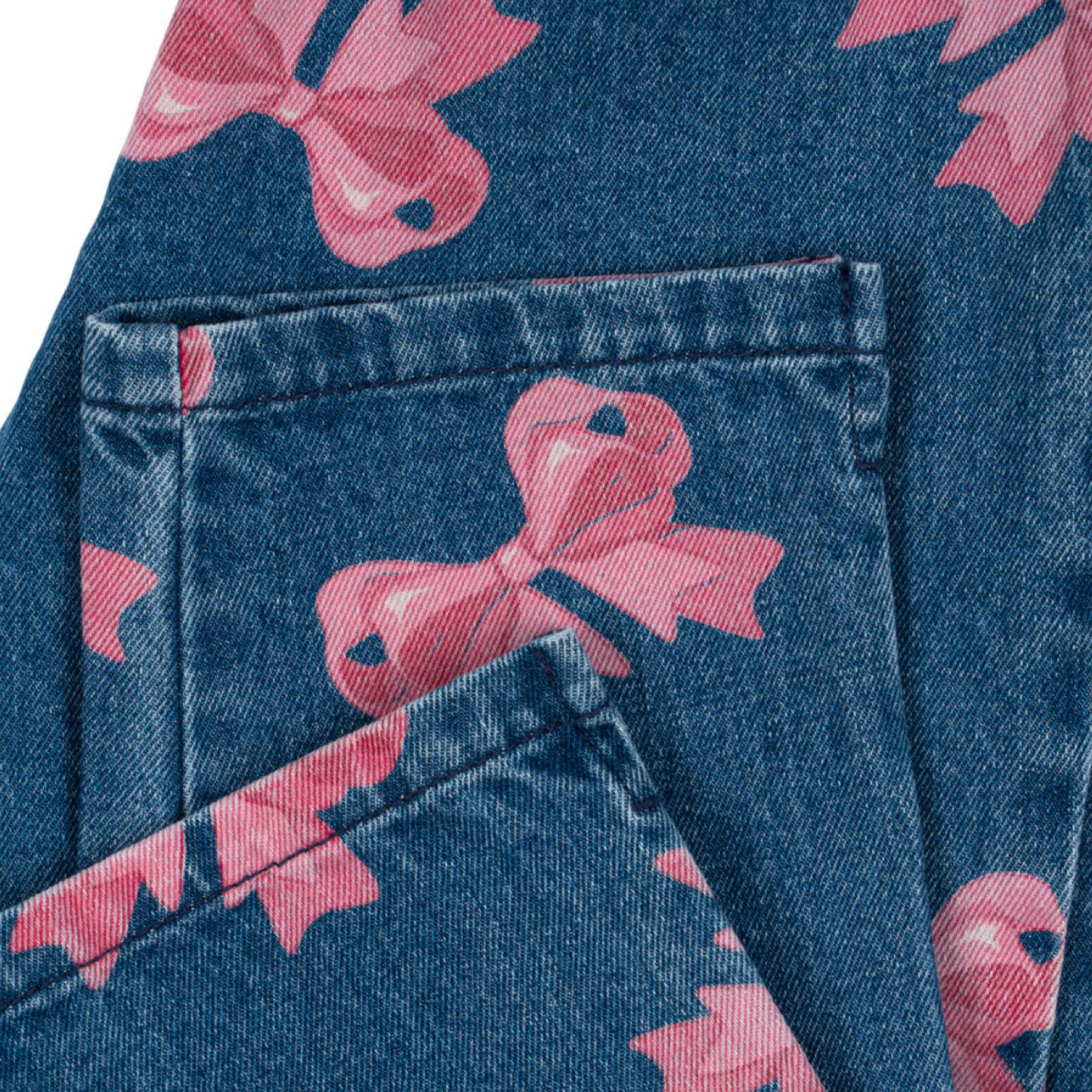 jeans in cotone organico con fiocchi rosa